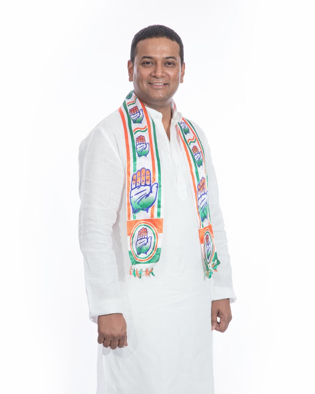 Mansoor Ali Khan in a white kurta and Congress scarf.